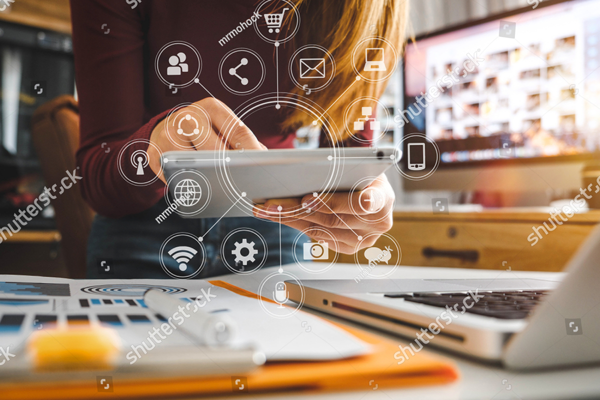 stock-photo--businesswoman-hand-working-with-laptop-computer-tablet-and-smart-phone-in-modern-office-with-1041718081