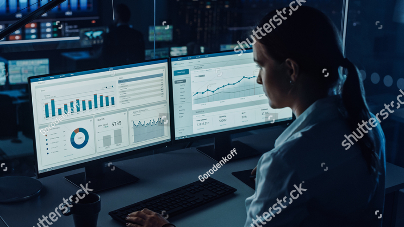 stock-photo-professional-financial-data-analysts-working-in-a-modern-monitoring-office-with-live-analytics-feed-1936992919